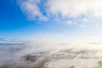 Aerial view clouds over forest. Aerial view of forest and clouds. Aerial drone view flying over the forest. Aerial top view cloudscape. Texture of clouds