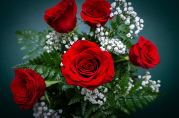 Top view of a bouquet of bright red roses