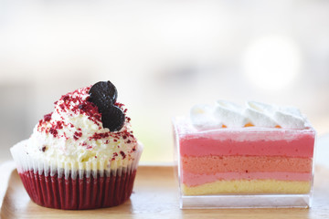 red velvet cake and delicious cake on the wood plate 
