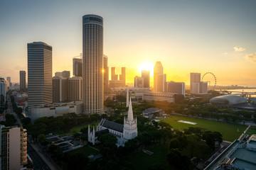 Fototapeta na wymiar Panorama of Singapore business district skyline and office skyscraper during sunrise in Marina bay, Singapore. Asian tourism, modern city life, or business finance and economy concept..