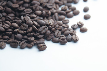 Close up of fresh and raw coffee bean on white 
