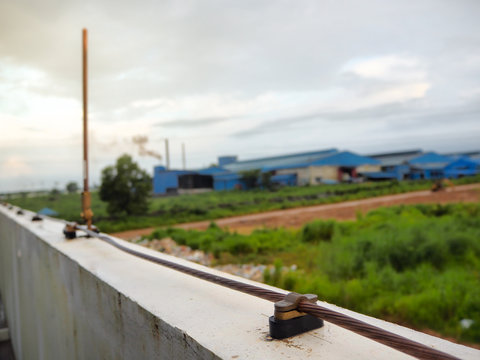Close-up bare copper and cable saddle of lightning protection on roof top