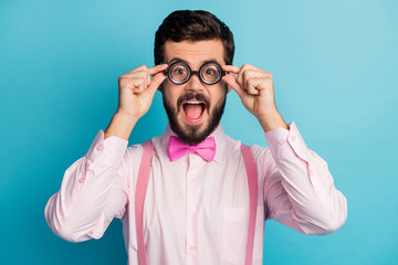 Portrait of astonished funky geek guy touch modern gentleman specs impressed wonderful novelty...