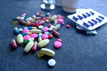 Fototapeta na wymiar Close up of pill and capsule on black background 