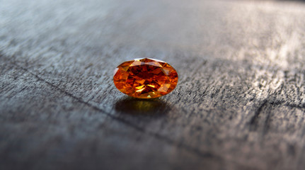 Yellow gem Beautiful on the wooden floor	