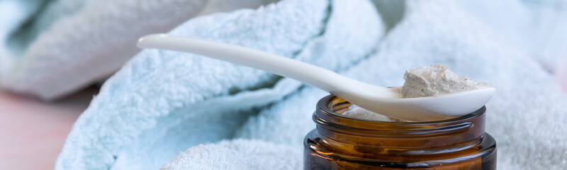 Hygiene bath product. Body, face scrub on towel. Wellness therapy regeneration