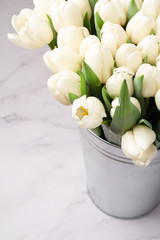 a large bouquet of white tulips and place for text