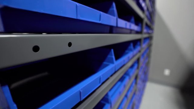 Storage stockroom bins in clean modern warehouse