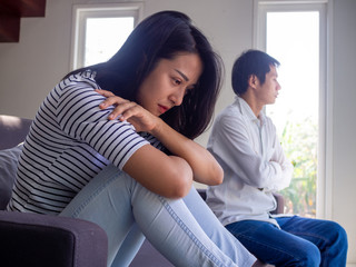 Sad couple not talking to each other after quarrel. Pensive upset woman feeling offended and...