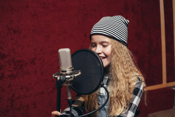young girl singing in studio