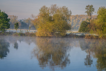 Early morning mist at the shore of the River Ruhr in Muelheim an der Ruhr, North Rhine-Westfalia, Germany