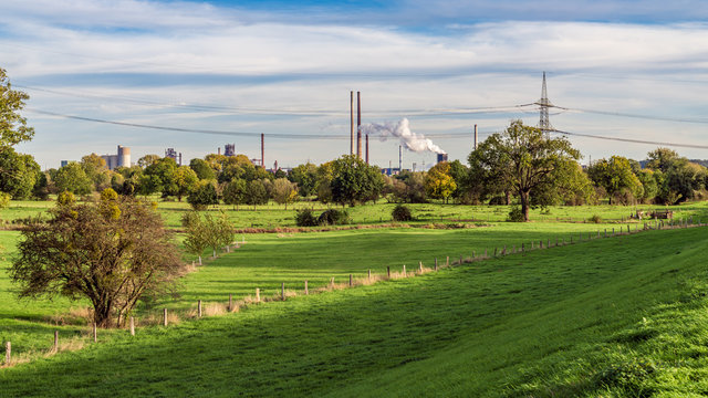 View from Orsoy over the meadows near the River Rhine in Duisburg, North Rhine-Westfalia, Germany