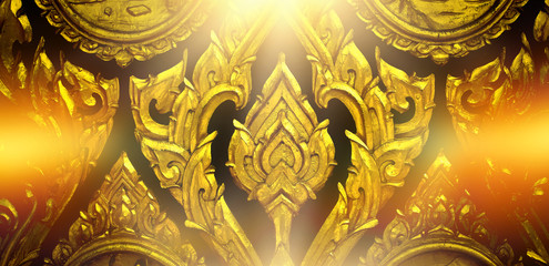 Thai motifs, carvings of lotus flowers, Thai bird's-eye patterns at the temple doors and soft light are beautiful background images.