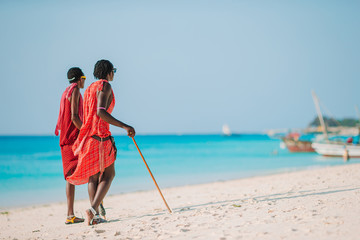 masai tribe member standing near the ocean in Zanzibar 11 February 2016 - obrazy, fototapety, plakaty