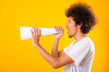 Asian handsome man with curly hair he announcing or spreading news using white speaker paper
