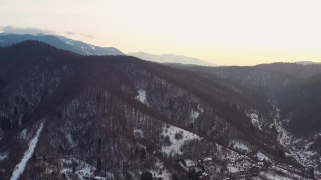 Aerial drone 4k clip of Brasov historical neighborhood Schei at sunset on a beautiful winter day