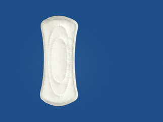 Women's hygiene products or sanitary pad on blue background
