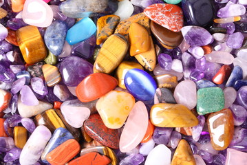 Collection of small semiprecious gemstones. Background image.
