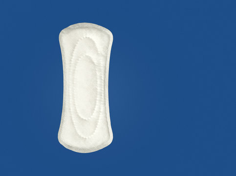 Women's hygiene products or sanitary pad on blue background