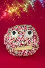 Funny face cake with red background, copy space