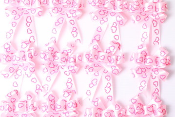 Pink bow isolated on white background.