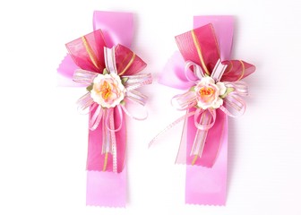 Red and pink satin gift bow. Ribbon. Isolated on white