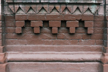Antique brickwork with a pattern. Brown brick texture.