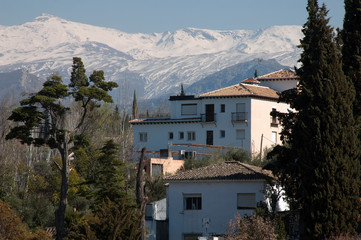 Fototapeta na wymiar Granada Spain, house with Sierra Nevada mountains in the background