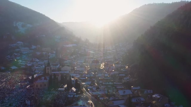 Aerial drone 4k clip of Brasov historical neighborhood Schei at sunset on a beautiful winter day