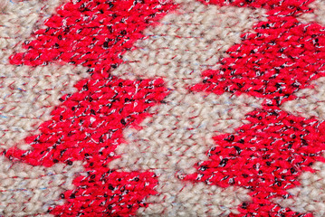 Fragment of knitted camel wool clothing. Close-up. Place for lettering or design.