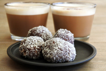 Sweet Chocolate balls served with two cups of cappuccino