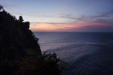 Sunset at the temple of uluwatu in Bali