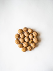 In shell walnuts in on a white background