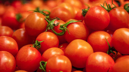 Top view of fresh red tomatoes on the store shelf.