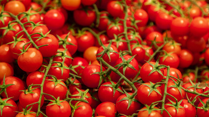 Top view of fresh red tomatoes on the store shelf.