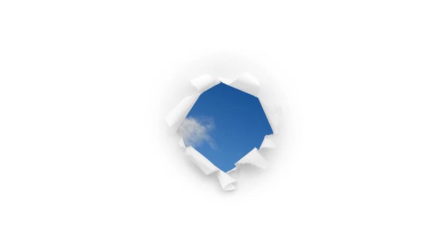 Creative 4k time laps video of fast moving clouds in the blue sky that are visible through a round hole with torn edges in white paper. The concept of expansion of consciousness, a happy future.