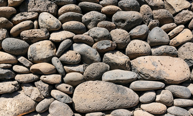 Texture of stone wall made of volcanic rocks