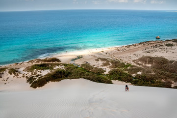 Top view from a sand dune on the coast of the Indian Ocean. exotic beautiful deserted island with a...