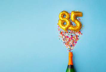 85th anniversary champagne bottle balloon pop