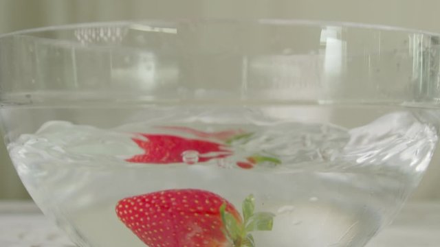 Strawberry Splash on Water - Slow Motion