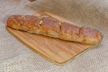 whole wheat flour home baked garlic baguette close up