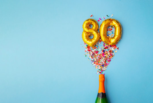 80th anniversary champagne bottle balloon pop