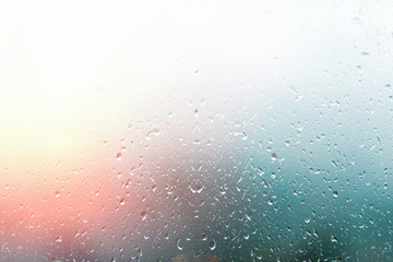 Raindrops on the window, the background is blurred. Colorful. Copy space