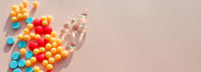 pharmaceutical pills thermometer a pink background. Copy space. the concept of health. concept  of life. assorted medicines. bright pills. coronavirus