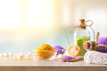 Products for body wellness on wooden table spa background