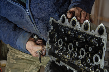 car engine repair by a specialist in service