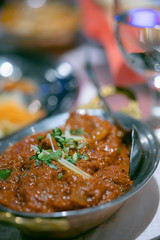 National dish in a Nepalese restaurant. meat rice, sauce. Food concept in a restaurant. Traffic photography using noise and adding noise