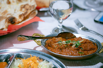 National dish in a Nepalese restaurant. meat rice, sauce. Food concept in a restaurant. Traffic photography using noise and adding noise