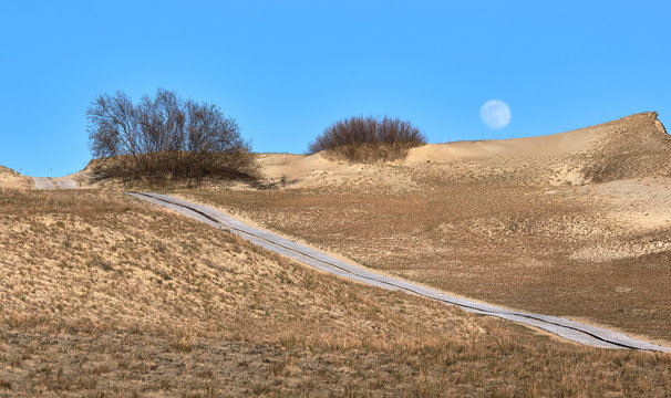 Sunset view of nordic dunes and Baltic sea at Curonian spit, Nida, Klaipeda, Lithuania
