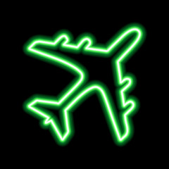 Green neon sign of airplane on black background